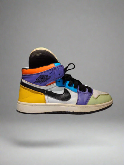Colorful sneaker with a brand logo on a gray background